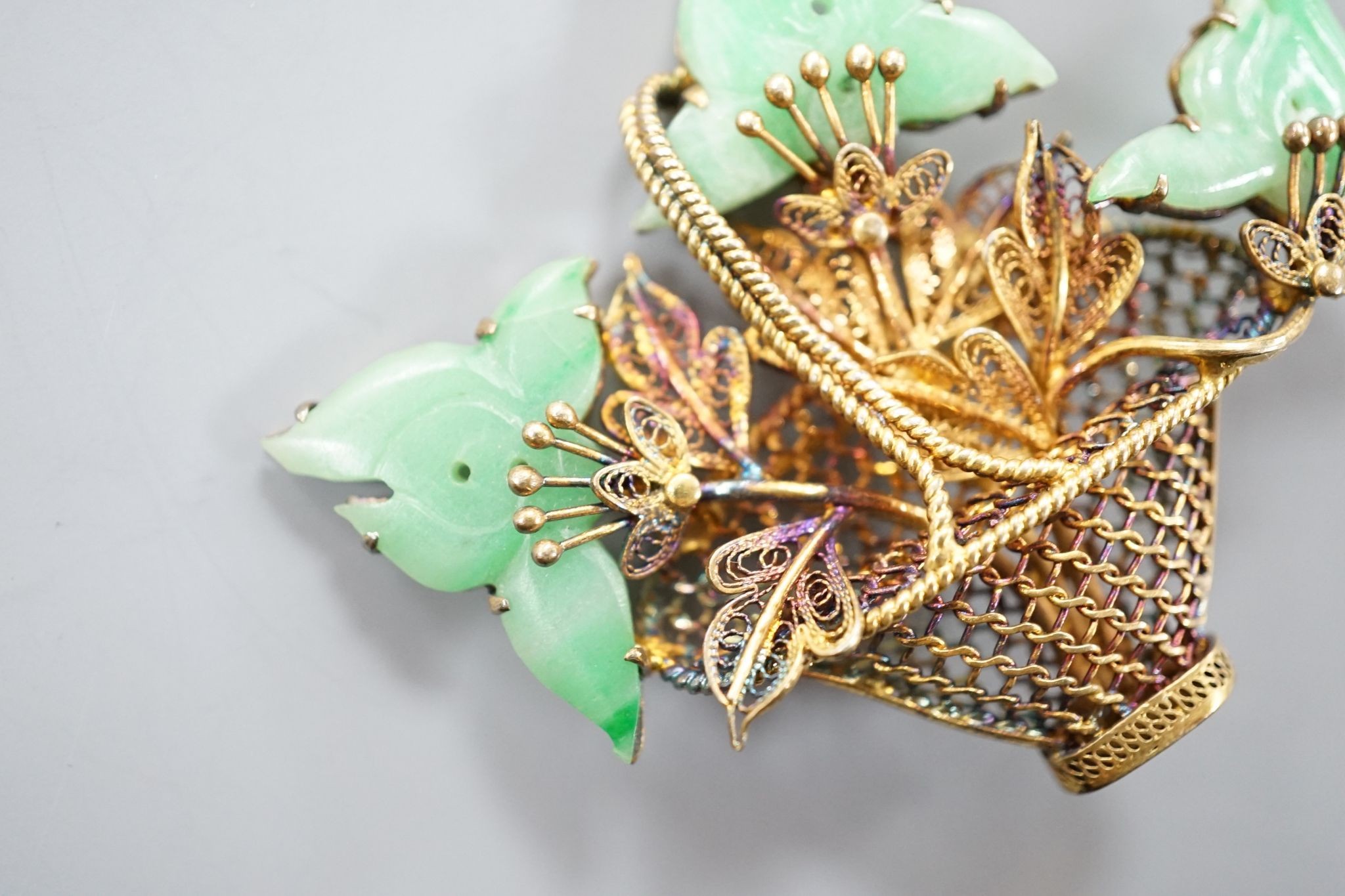 A continental gilt white metal and simulated jade set 'Basket of Flowers, brooch, height 49mm.